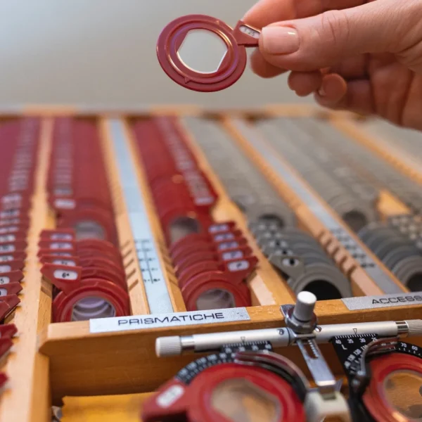 optometrist-choosing-lenses-testing-patient